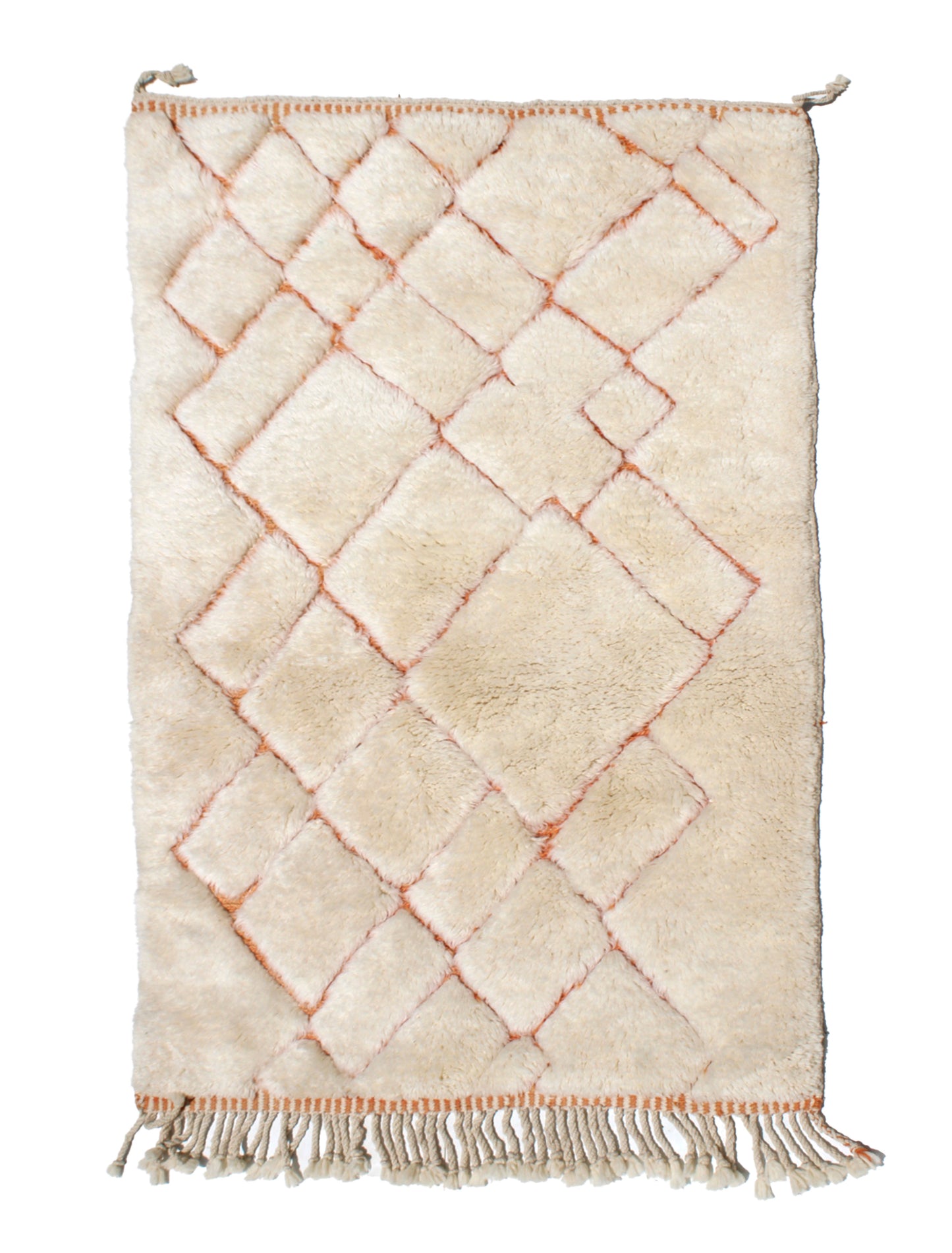 Hand-knotted cream Moroccan wool rug with a raised terracotta diamond lattice pattern and natural ivory fringed edges.

