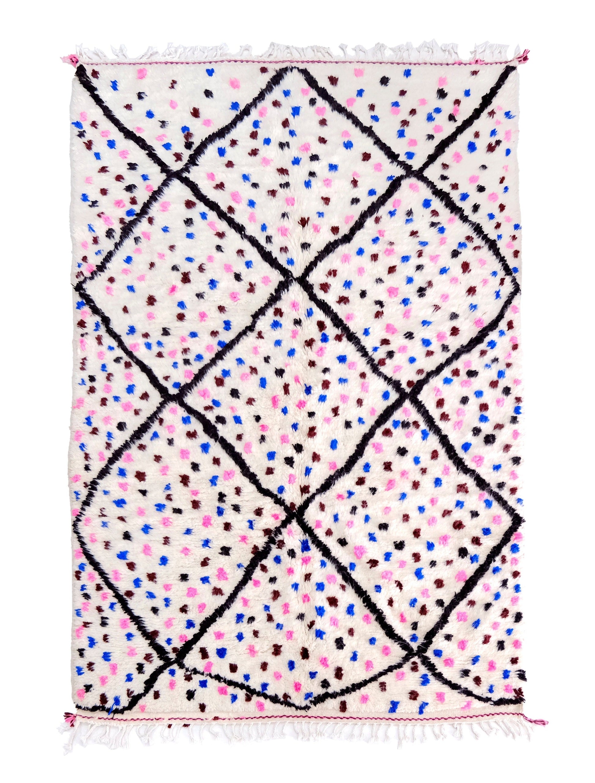 A cream-colored handwoven Moroccan shag rug featuring a large black diamond trellis pattern filled with scattered colorful dots in pink, blue, and maroon, finished with white fringe on the top and bottom edges.

