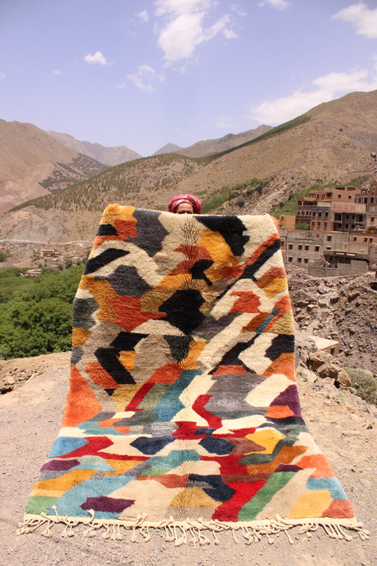 "Vintage Moroccan rug with bold diamond shapes and textured wool weave."